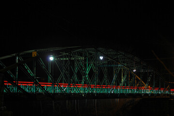 bridge at night over river 