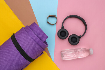 Flat lay composition sports and fitness accessories on colorful background. Ready for training. Top view