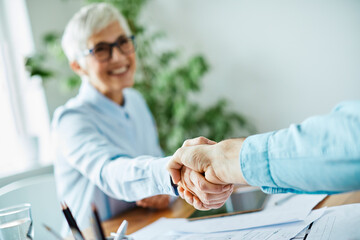business woman senior office hand shaking meeting agreement handshake partnership success contract