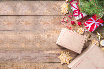 Christmas gChristmas Gift Box package. Gift exchange Christmas New Year concept on covid-19 pandemic. Secret Santa post game. Packing gifts, cookies in parcel. Wooden backgrift box mail parcel package