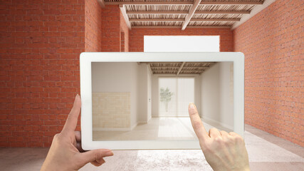 Augmented reality concept. Hand holding tablet with AR application used to simulate furniture and design products in an interior construction site, empty interior with ceramic tiles