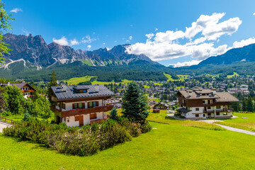 Tourist huts in Cortina d'Ampezzo on a sunny summer day, Dolomites mountains, Italy