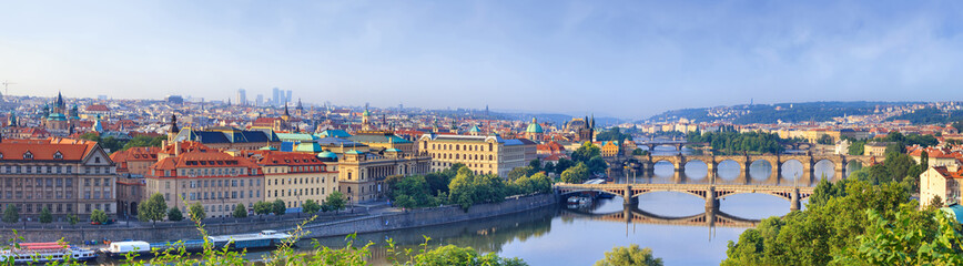 Fototapeta premium City summer landscape, panorama, banner - top view of the historical center of Prague with the Vltava river, Czech Republic