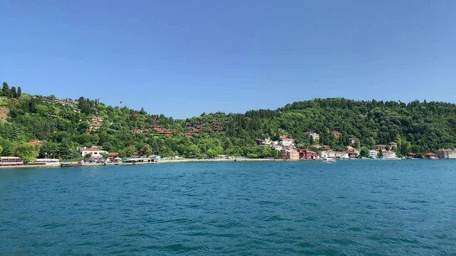 Footage of Anadolu hisari / Kandilli area of Istanbul by Bosphorus. Beautiful scene. It is a sunny summer day. Camera moves forward.