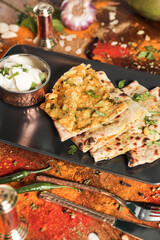 Assortment of various kinds of Indian cousine Indian Food on Wooden rusty table