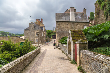 Fototapeta na wymiar Josselin, France. Old stone buildings in cloudy weather