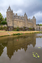 Fototapeta na wymiar Josselin, France. Scenic view of the castle and its reflection in the river