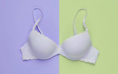 Stylish bra on colored background. Pastel color trend. Beauty and fashion minimalistic still life