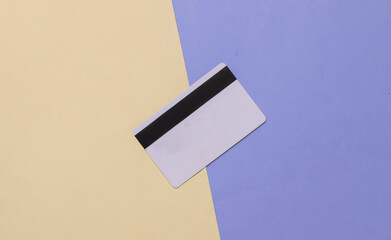 Bank card on pastel background. Top view