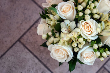 Beautiful wedding bouquet in pastel colors on lilac background. Delicate bouquet for bride. Close-up. Copy space.