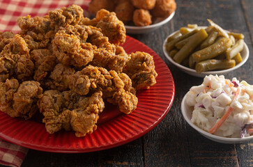 Fried and Crispy Chicken Gizzards on a Dark Wooden Table
