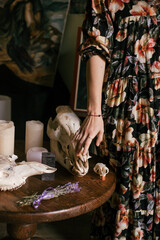 woman hand on a skull