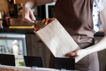 Offering fresh tasty sweet bun in bakery. No face