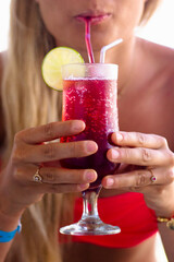 girl with soft fizzy drink on holiday