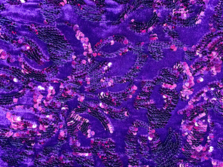 Violet sequined fabric texture - pink and purple sparkling sequins background. Festive, carnival or fashion background concept. Luxury textile design. Copyspace for your text