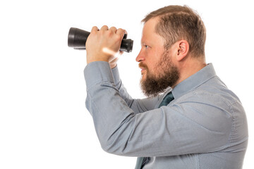 Fototapeta na wymiar Soilid bearded man in shirt with binoculars
