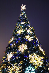 Christmas tree with new year decorations. New Year celebration. Selective soft focus. Background for postcards