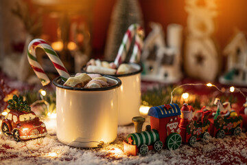 Hot chocolates surrounded with christmas decorations