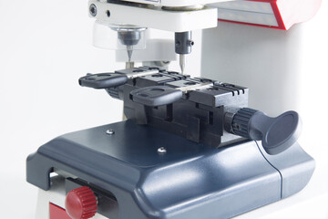 Production of car keys on a specialized key machine.