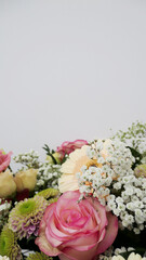 fresh bouquet with pink roses isolated on white - copy space