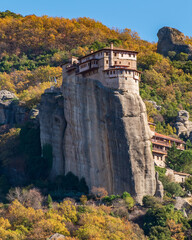 Fototapeta na wymiar Roussanou monastery, an unesco world heritage site, located on a unique rock formation above the village of Kalambaka during fall season.