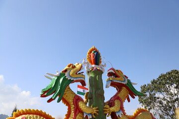 Tashi View Point two Chinese yellow dragon statue in Gangtok,India.A famous tourist place with...