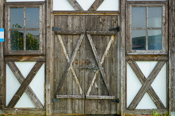 vintage entrance doors made of aged natural wood