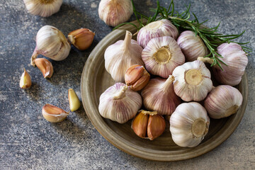 Healthy food. Garlic Cloves and Bulb on a stone or slate table.