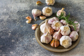 Healthy food. Garlic Cloves and Bulb on a stone or slate table. Copy space.