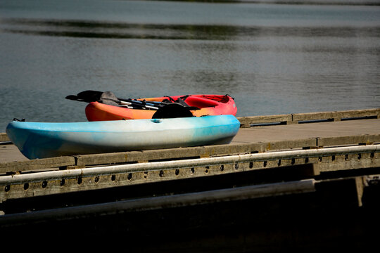 Canoe Boats on Pier by Lake