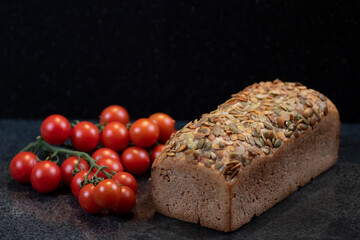 Pumpkin seed bread with fresh cherry tomatoes