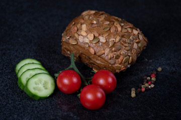 Roasted pumpkin seeds bread roll with fresh vegetables