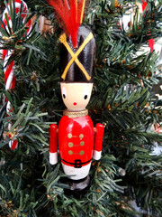 A wooden vintage soldier Christmas ornament.
