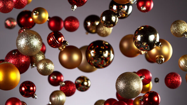 Flying christmas balls on coloured background