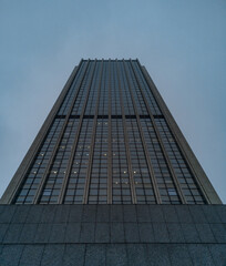 Upward view to high skyscraper full of offices