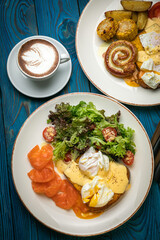 English breakfast, toast, poached egg, sauce, salmon
