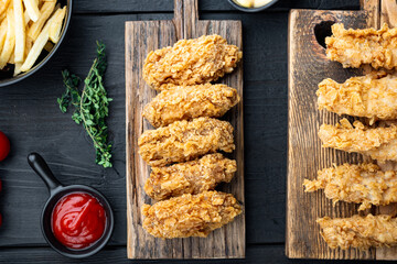 Korean barbeque fried chicken on black wooden table, flat lay