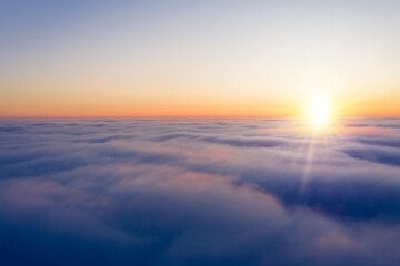 Arial view from plane on the sunrise sky