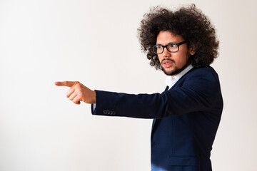 Latin American model in a suit, angry expression, white background 