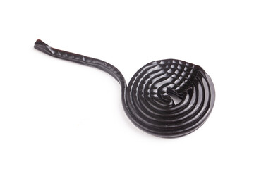 Licorice wheels on white background.