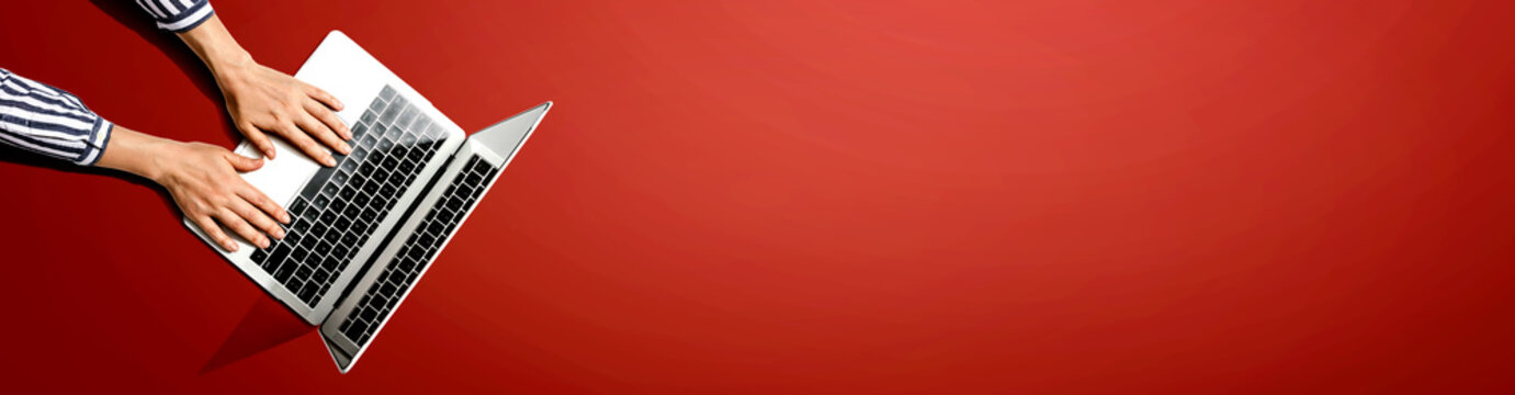 Person using a laptop computer from above