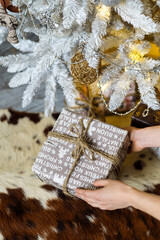 Woman with christmas gift box in hands