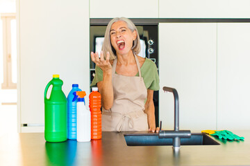 middle age woman looking angry, annoyed and frustrated screaming wtf or what’s wrong with you
