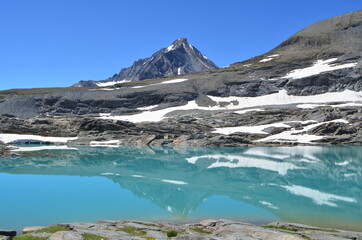 Obraz premium View of the Dent Parrachée mountain with the lac de l'Apont in the Vanoise National Park, France