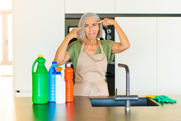 middle age woman with a serious and concentrated look, brainstorming and thinking about a...