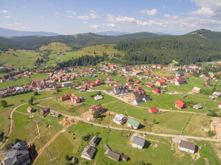 Fototapeta na wymiar Greate Green Mountaines. Aerial foto of Village