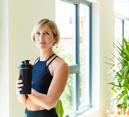 pretty blonde woman doubting or thinking, biting lip and feeling insecure and nervous, looking to copy space on the side