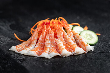 Sushi Rolls Set, maki, philadelphia and california rolls, on a Black background.