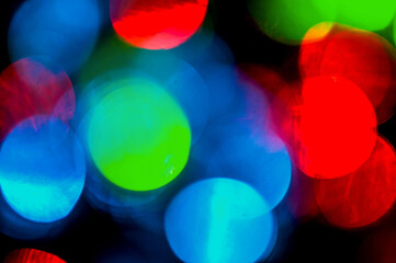 De-focused abstract background Chrismas lights. Blurred and luminous lights. Bokeh. Blur effect. Colorful festive background.