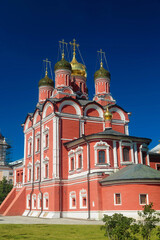 Fototapeta na wymiar Facade of red brick Christian cathedral building in Moscow